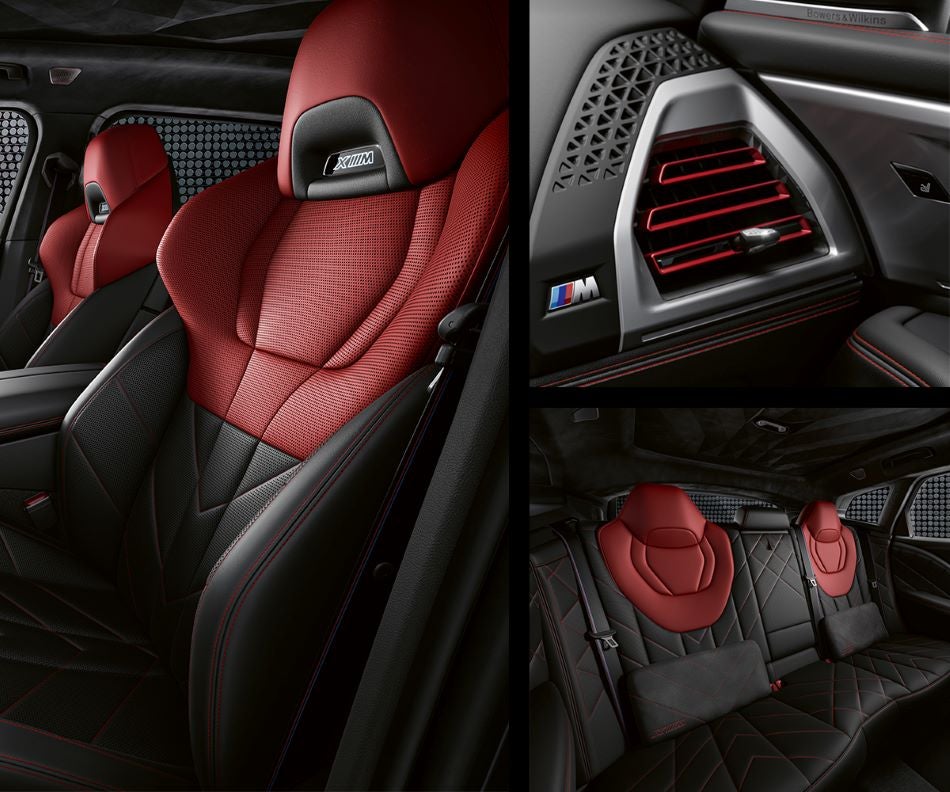 Detail of front seats, clad in exclusive BMW Individual Fiona Red & Black Merino Leather with exclusive M Signature Trim and red stitching and accents. Detail of red accented vent. Detail of rear M Lounge with exclusive XM pillows in BMW of Palm Springs | Palm Springs CA
