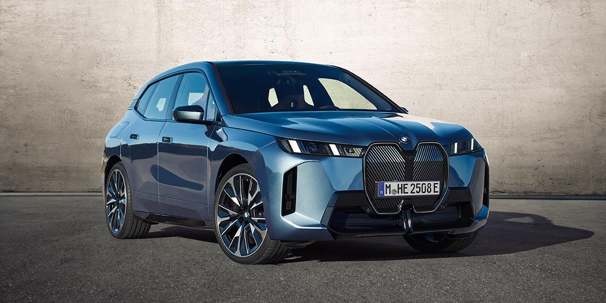 Artic race blue metallic 2026 BMW iX xdrive60 left front view in Palm Springs, CA