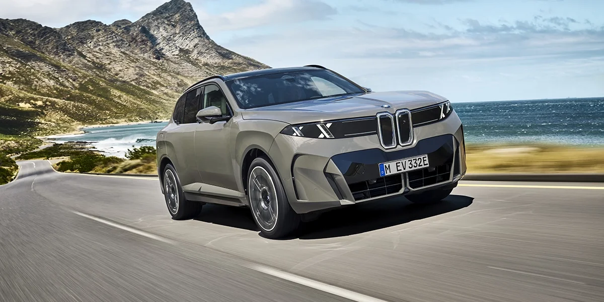 2027 BMW X5 Neue Klasse SUV parked outside a modern luxury home in Palm Springs, California.