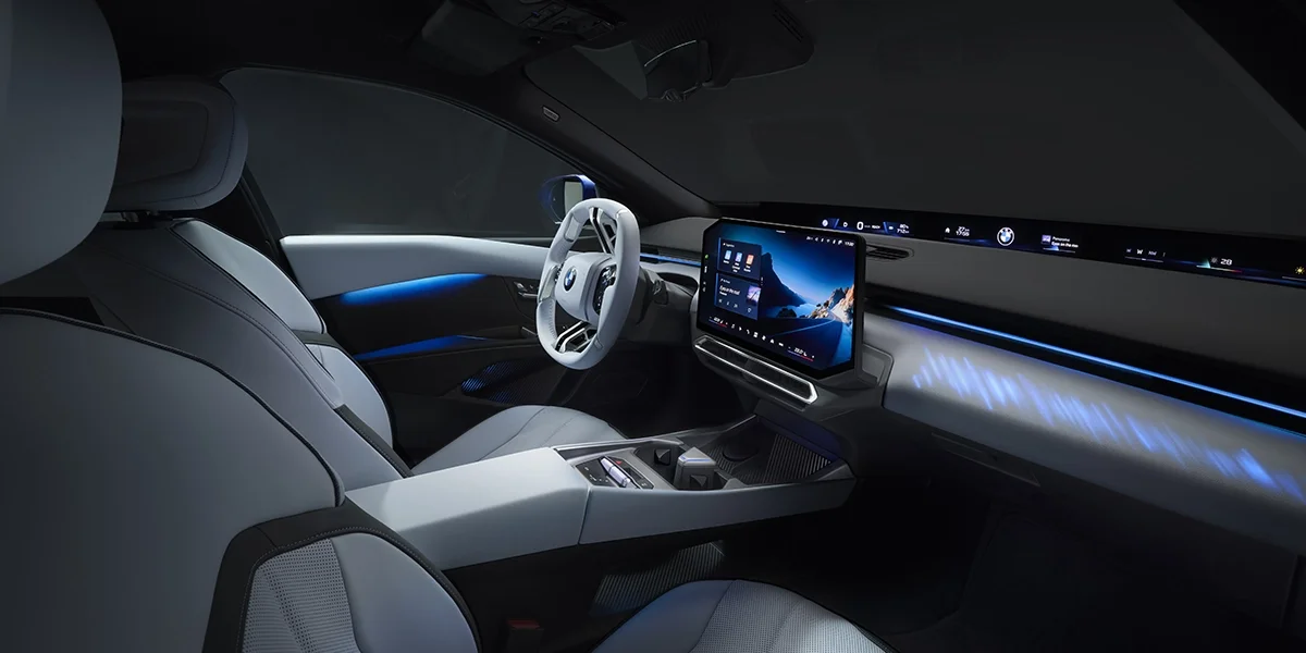 Interior of 2027 BMW i3 featuring digital dashboard, ambient lighting, and modern cabin layout.