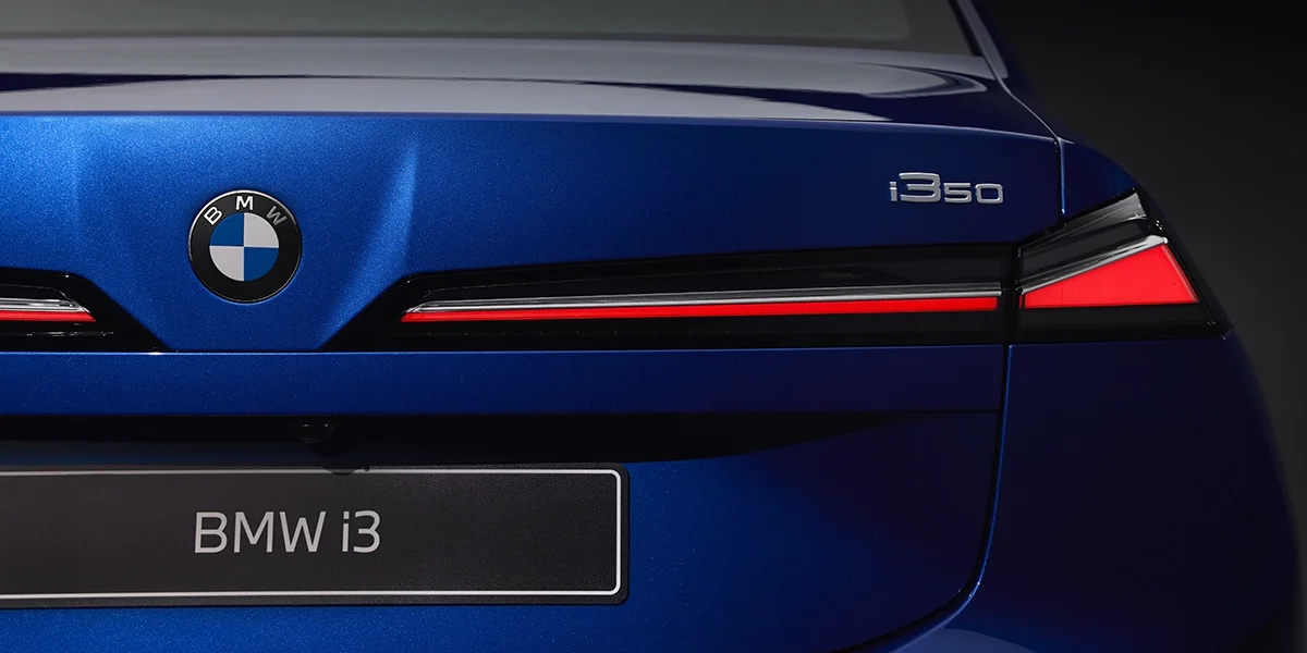 Close-up of BMW i3 rear badge and taillight design detail.