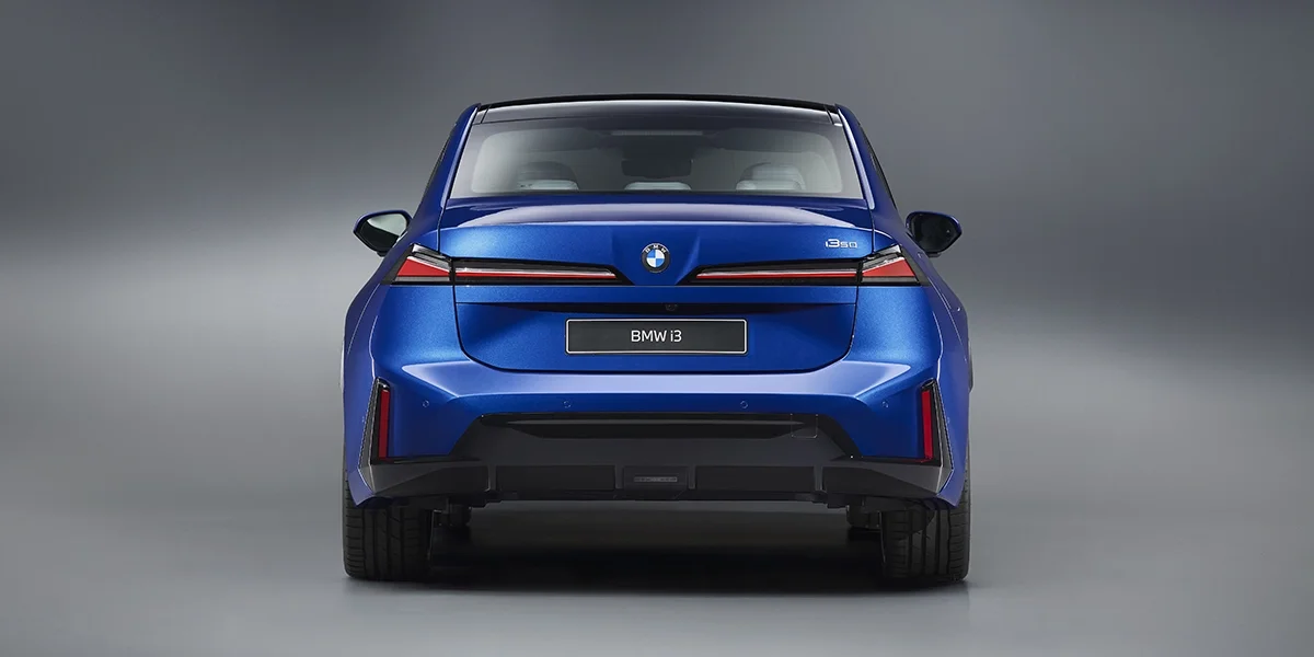 Rear view of 2027 BMW i3 electric sedan with slim LED taillights and modern styling.