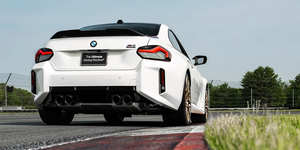 2026 BMW M2 Turbo rear view highlighting quad exhaust, carbon diffuser, and aerodynamic rear design.