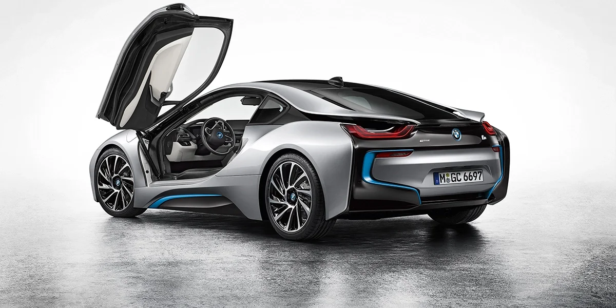 BMW i8 rear angle with open butterfly doors and sculpted tail design