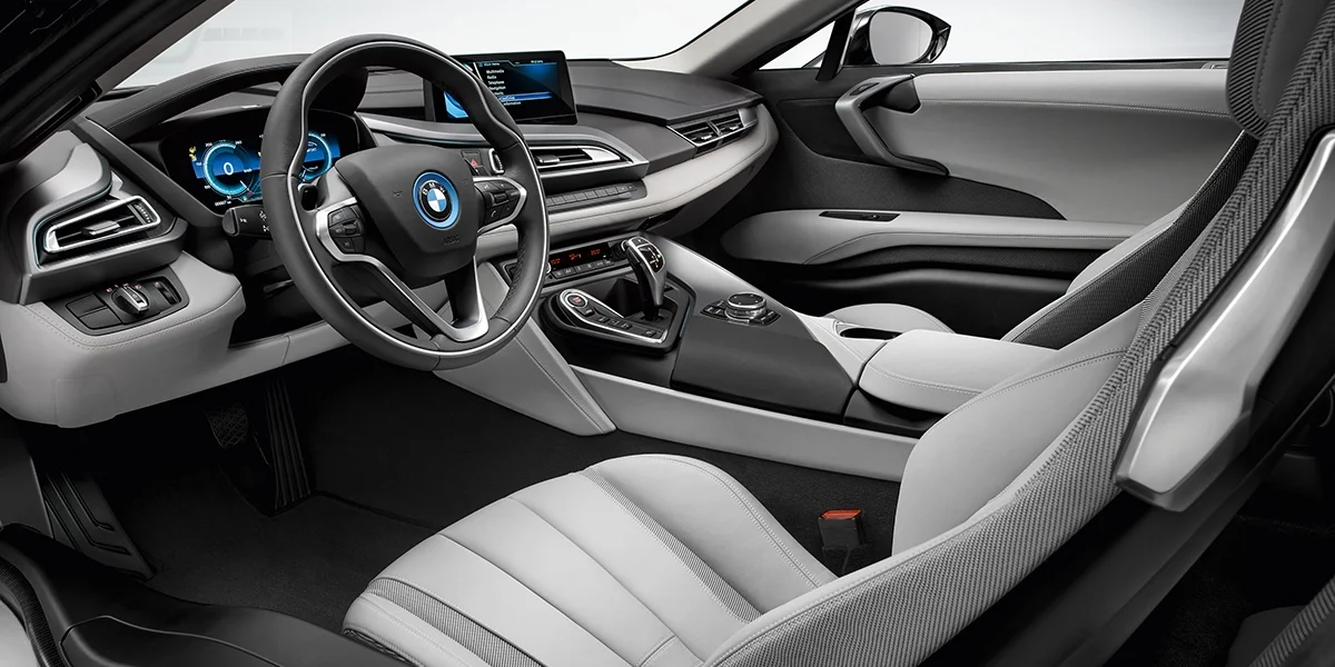 BMW i8 interior with futuristic cockpit design, digital driver display, and premium leather seats